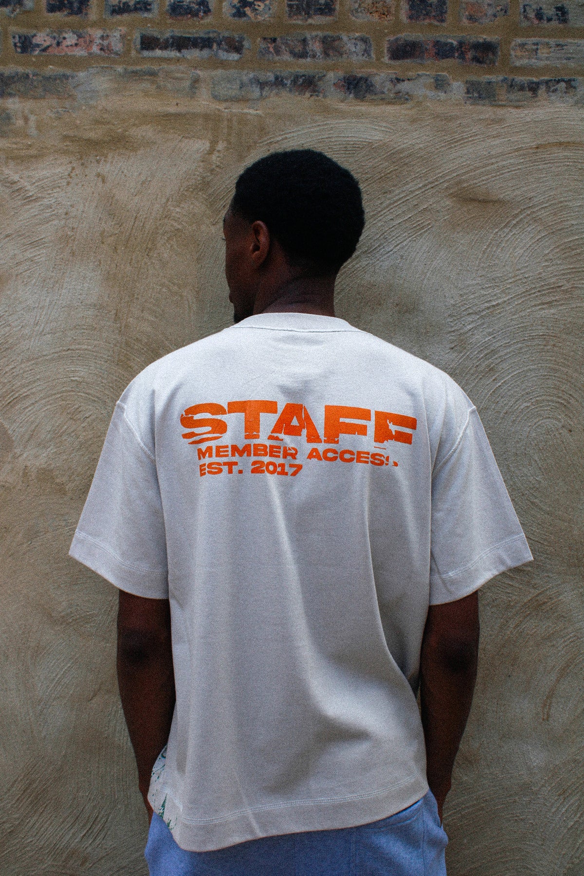 Orange/Green “Red Man Tee”