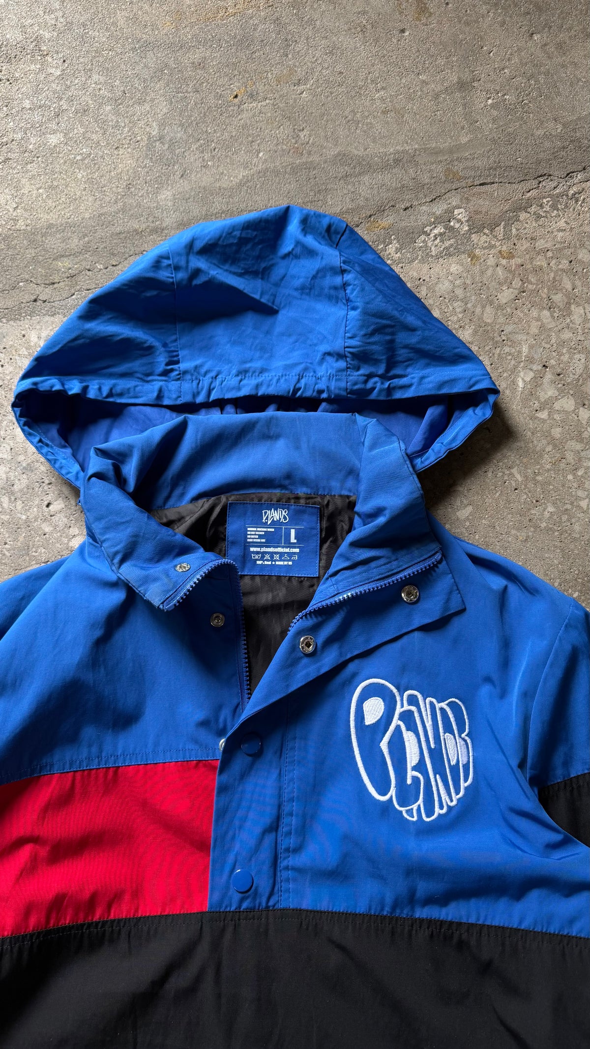 P.LANDS Badge Windbreaker